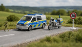 Siku VW T6 police van and BMW police motorbike 2562 displayed in a roadside scene with speed camera and 30 km/h sign