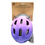 Pink and purple junior cycling helmet mounted on branded cardboard backing card, top view showing ventilation slots