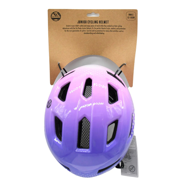 Pink and purple junior cycling helmet mounted on branded cardboard backing card, top view showing ventilation slots