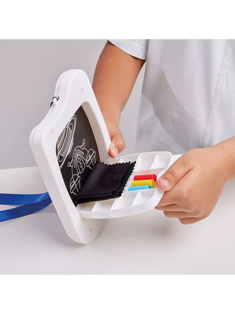 Child opening Sketch and Glow Space drawing board to reveal storage compartment with pens and cloth