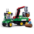 Sluban Log Trailer Large shown from the front side with green cab, six wheels, raised red crane, grey claw holding a brown log and worker figure beside the vehicle