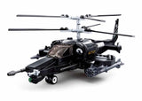 Sluban Model Bricks KA-50 Black Shark helicopter shown from the front side with dark cockpit canopy, twin stacked rotor blades, nose gun, rocket pod, side weapon mounts and landing wheels