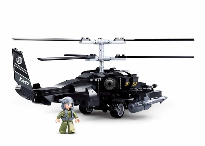 Sluban Model Bricks KA-50 Black Shark helicopter shown from the front side with clear cockpit, twin rotor assembly, nose gun, side mounted rocket pods, landing gear and pilot figure