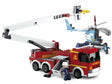 Sluban Platform Fire Truck and Helicopter set showing the red six wheel fire truck with its long white ladder fully extended, firefighter in the raised platform, blue helicopter and firefighter figures