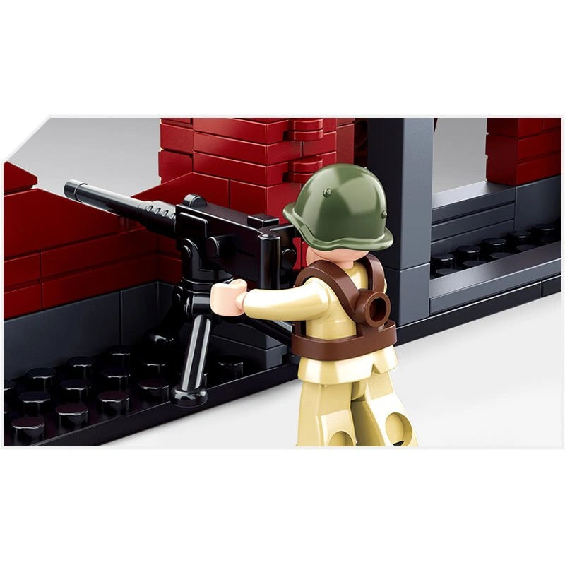 Close view of a Sluban soldier figure operating a mounted machine gun beside the red brick ruined building section