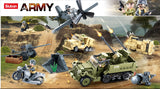 Sluban WWII Set battle scene showing a grey propeller aircraft, green half track with twin guns, tan military vehicles, motorcycle, field cannon, weapon positions and soldier figures