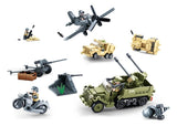 Sluban WWII Set showing the green half track, grey propeller aircraft, tan military vehicles, motorcycle, field gun, weapon positions and soldier figures arranged together