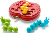 Red apple-shaped board with yellow, green and blue caterpillar pieces