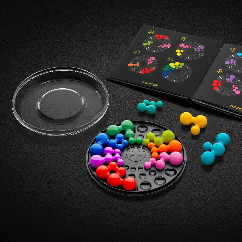 SmartGames IQ Circle game board with clear lid, loose pieces and open challenge pages