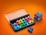 SmartGames IQ Quub open puzzle case with colourful pieces, small cube and loose blue piece