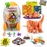 Smashers Dino VS Aliens Rocket Series 1 product collage showing grey smash egg rocket with orange fins and Smashers Dinos vs Aliens label, orange triceratops figure, cards, small dinosaur and alien figures, stickers, two mini eggs with rock base, and orange UFO with green dome and grey accessories, with “Smash Build & Battle” and “Over 20+ surprises inside” graphics