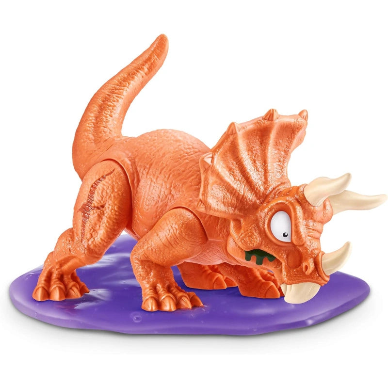 Orange triceratops dinosaur figure with black horn tips standing on translucent purple slime base