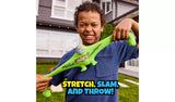Child pulling the green elephant faced Smashers Brain Rot figure into a wide stretched shape outdoors