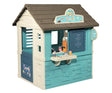 Smoby Life Playhouse Sweety Corner front view with blue and cream outdoor sweet shop playhouse