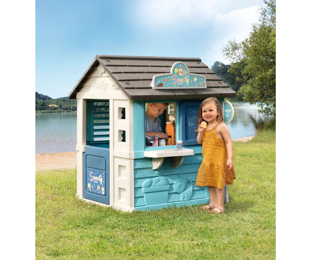 Smoby Life Playhouse Sweety Corner in garden setting with children playing at the shop counter