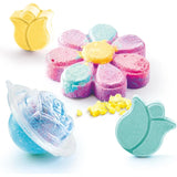 So Bomb DIY Flower Bath Bomb Kit display with colourful flower-shaped bath bombs and bath bomb making accessories arranged against a white background.
