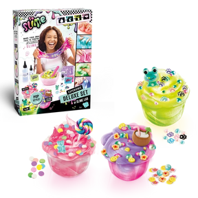 So Slime Experience Deluxe Set Pop Style retail box displayed alongside three finished pink, green and purple slime pots decorated with sweets, a frog charm, paw prints, flowers and a coconut drink.