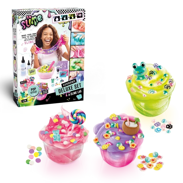 So Slime Experience Deluxe Set Pop Style retail box displayed alongside three finished pink, green and purple slime pots decorated with sweets, a frog charm, paw prints, flowers and a coconut drink.