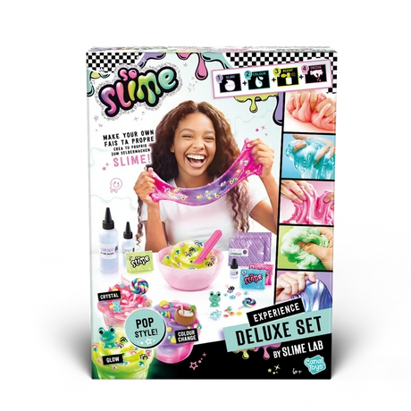 Front of the So Slime Experience Deluxe Set Pop Style packaging showing a smiling girl stretching pink slime, a mixing bowl, slime ingredients and colourful decorated slime pots.