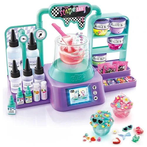 So Slime Experience Lab with turquoise and purple electronic laboratory, mixing bowl containing pink slime, ingredient bottles, slime containers, colourful decorations and two finished slime pots with miniature charms.