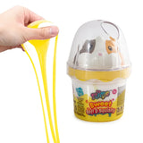 So Slime Sweet Soft & Squishy yellow and white slime being stretched beside a yellow pot containing a white cat squishy with black and orange patches.