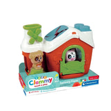 Clementoni Soft Clemmy Sensory Farm retail display showing the red barn with white roof, green windmill, brown dog and white cow figures, with packaging stating eight soft blocks, two characters and suitability from 6 to 36 months.