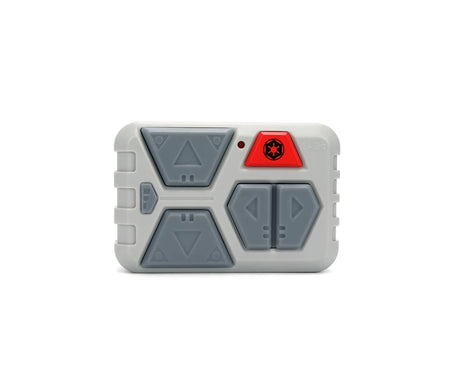 Close-up of the Star Wars AT-AT grey remote controller with directional buttons, red Imperial emblem button and 2.4 GHz marking.