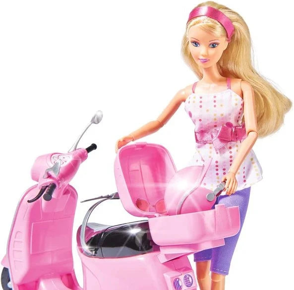 Steffi Love doll standing beside the pink scooter with the rear storage compartment open, showing the storage space inside