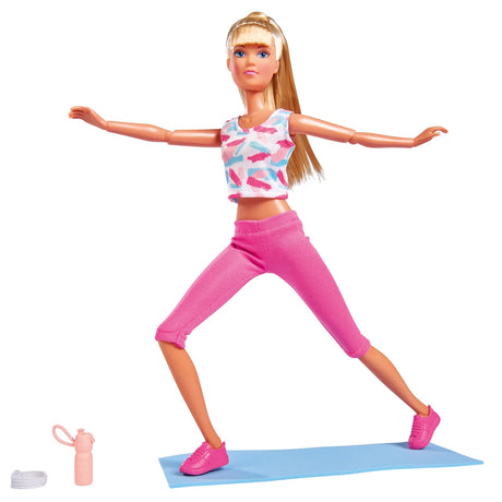 Steffi doll posed in a wide stance on her blue yoga mat, bottle beside her – Ireland