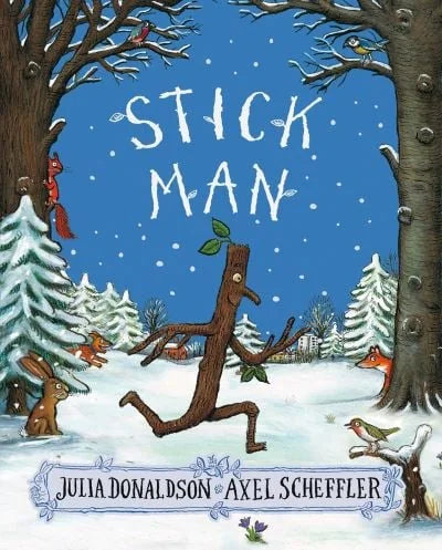 Storybook cover of Stick Man featuring Stick Man running in snow with rabbits, fox and birds in Ireland