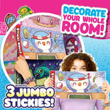 Child holding large illustrated Sticki Rolls character stickers, including a smiling white character wearing a red and blue headband, with colourful sticker artwork behind.