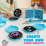 Child arranging Sticki Rolls inside open turquoise storage compartments, with bracelet cords, beads, sticker rolls and the blue handbag strap on a table.