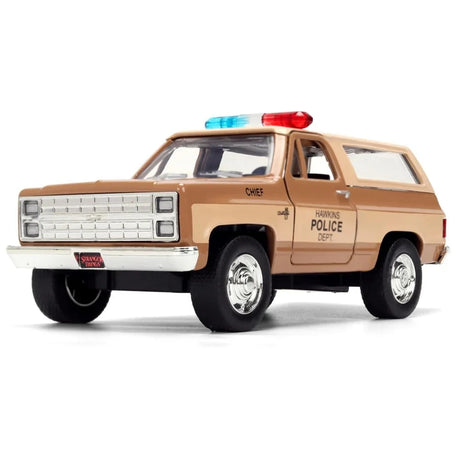 Stranger Things Hopper's Chevy Blazer die-cast model in tan with Hawkins Police Dept markings, roof light bar and chrome grille