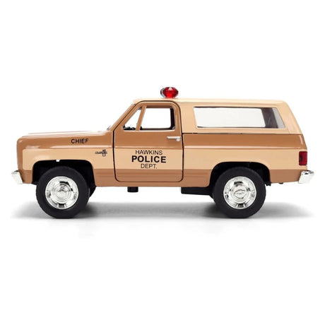 Stranger Things Hopper's Chevy Blazer die-cast model left side view showing Chief and Hawkins Police Dept door markings
