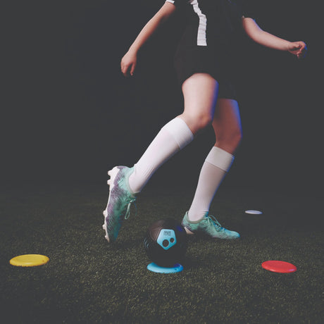Close-up of Strikesphere Soccer Dash smart ball hitting target in indoor training setup in Ireland
