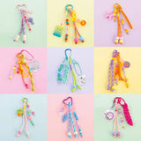 Nine colourful DIY keychain designs with cords, beads, clips and assorted charms