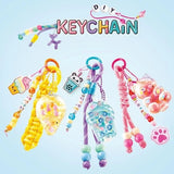 Three Style 4 Ever DIY keychains in yellow, blue and pink with beads, cords and clear filled charms