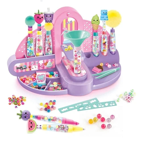 Style 4 Ever pink pen factory station with decorated pens, funnel, beads and accessories