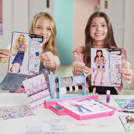 Children displaying completed fashion designs using the Style 4 Ever Fashion Designer Light Up Studio in Ireland
