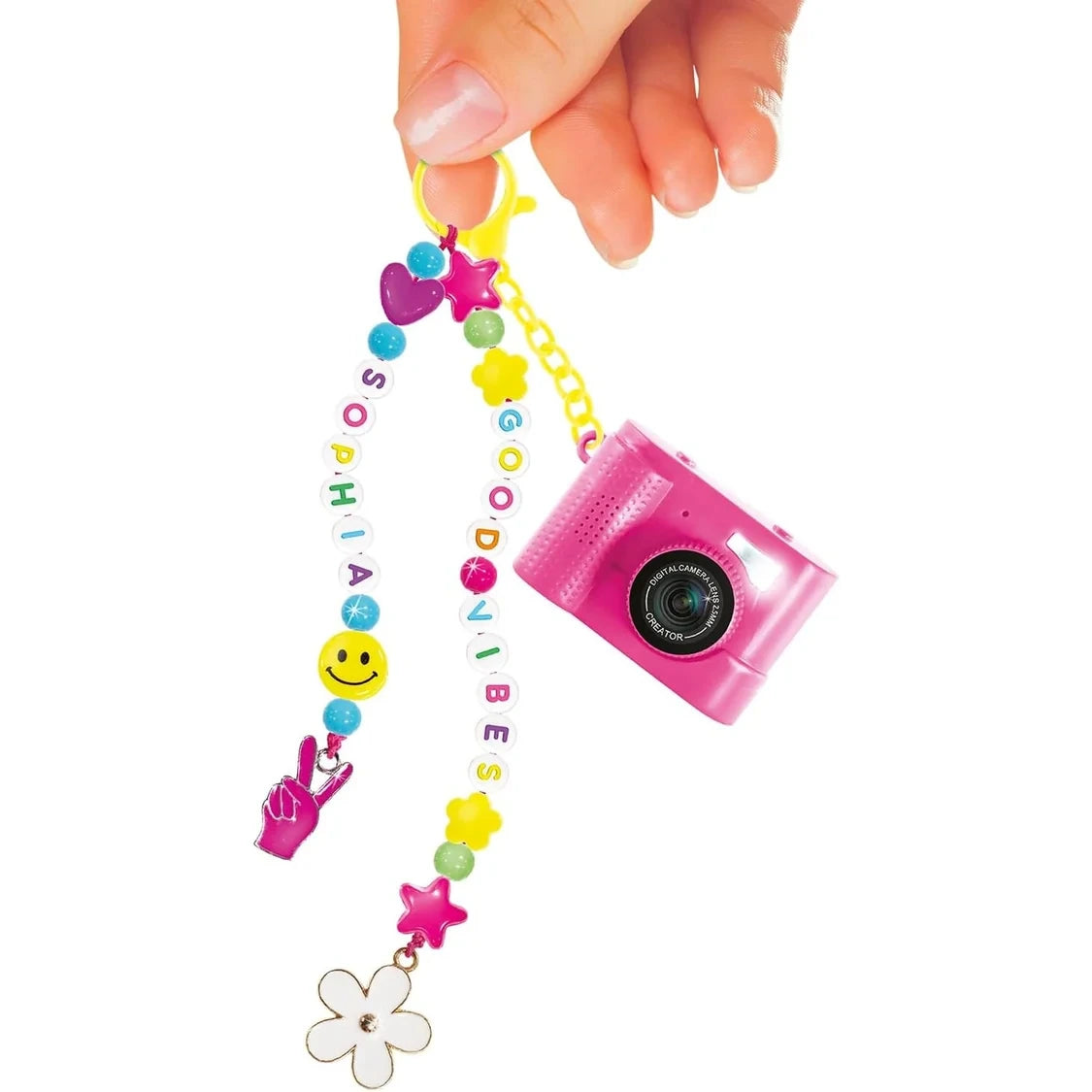 Pink Style 4 Ever mini camera hanging from a yellow clip alongside two strands of colourful beads spelling SOPHIA and GOOD VIBES, decorated with hearts, stars, smiley face, flower and hand charms.