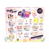 Back of the Style 4 Ever Scrapbooking Studio Pro box showing the four crafting functions and illustrated kit contents, including the workstation, cutting and embossing plates, markers, decorative tapes, scrapbook, sticker sheets and paper decorations.