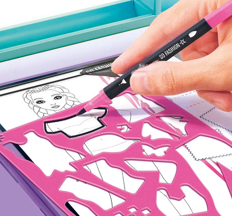 Hand tracing top with stencil onto model sheet in Fashion Designer Studio – Ireland