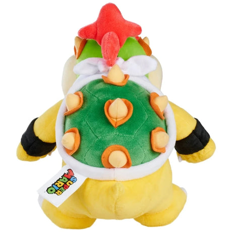 Rear view of Super Mario Bowser Jr plush showing the green shell with six cream spikes, white shell border, red hair, yellow body and Super Mario fabric label.