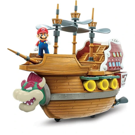 Side view of the Super Mario Bowser's Airship playset with Mario figure on deck, Bowser head front and propeller masts