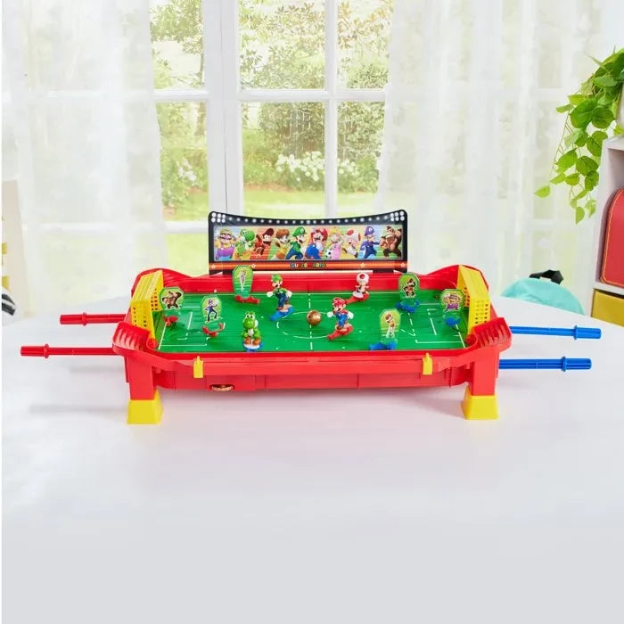 Super Mario Football Striker game board shown on a white table in front of a window