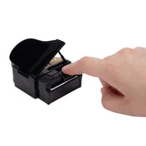 Hand pressing a key on the piano accessory from the Super Mario Galaxy Movie Bowser Castle Playset