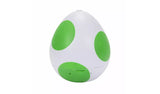 Super Mario Galaxy Movie Yoshi Egg Playset completely closed, showing the white egg with three large green spots against a plain white background.
