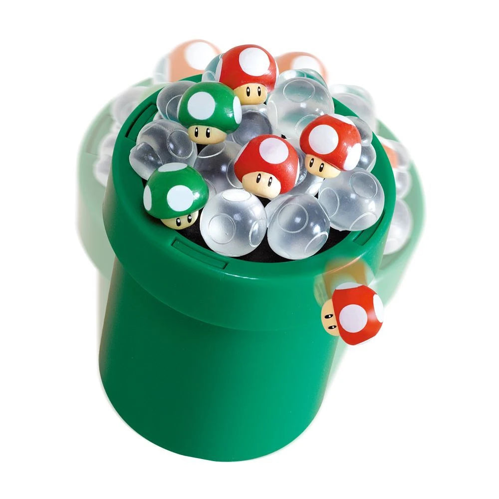 Close-up of the green pipe balancing base filled with red, green and clear mushroom pieces