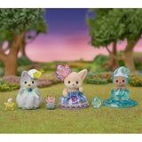 Sylvanian Families fairy babies standing in a grassy flower garden, showing the husky's white costume, the fennec fox's purple dress and the sea otter's translucent blue water droplet costume.