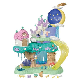 Complete Sylvanian Families Woodland Wonder Fairy Castle on a white background with pink-roofed flower house, purple castle towers, yellow slide, waterfall, figures and miniature accessories.